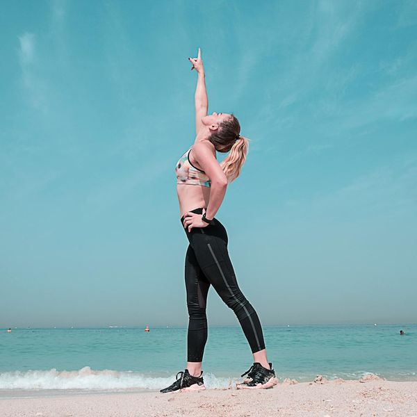 Person stretching calmly outdoors, embodying well-being.